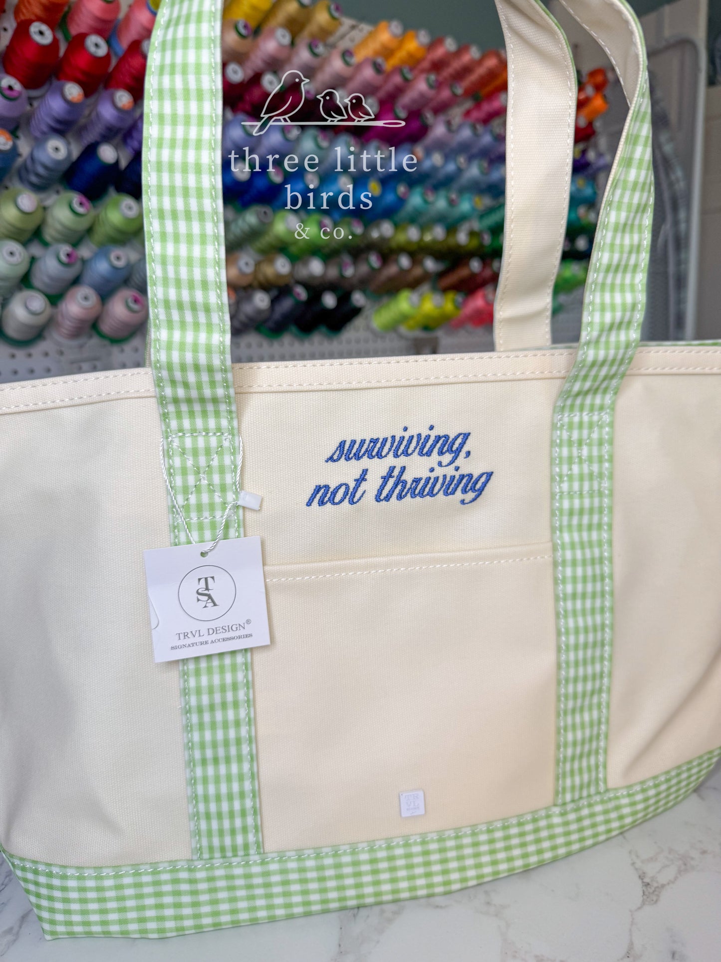 "surviving, not thriving" Gingham Leaf TRVL Medium Tote