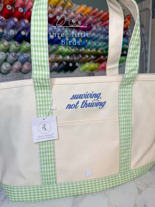 "surviving, not thriving" Gingham Leaf TRVL Medium Tote